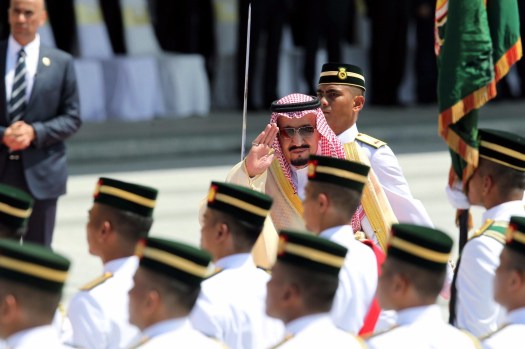 King Salman Abdulaziz Al-Saud salutes the colours